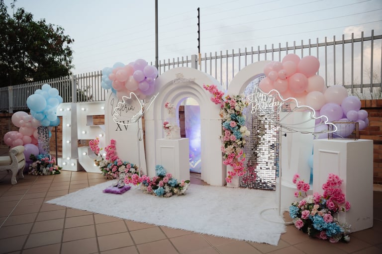 Neon sign number at a birthday party with balloon and flower decorations